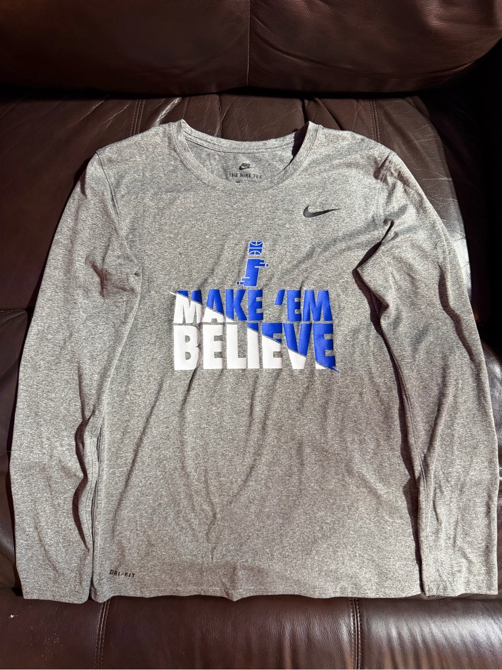 Nike Grey Long Sleeve Dri-FIT 'Make 'Em Believe' Shirt with Blue & White Graphic